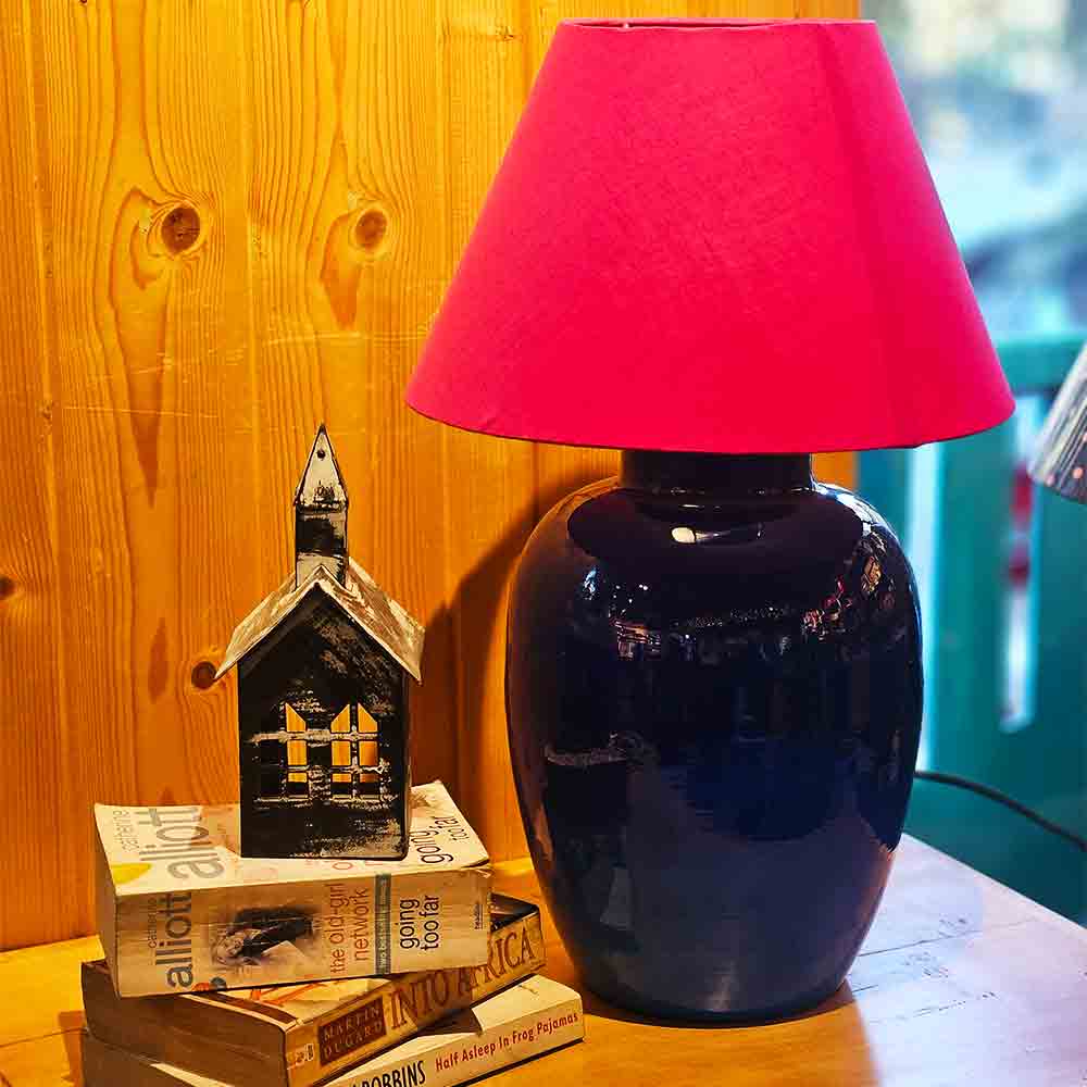 Yellow Marigold Aura metal table lamp on a bedside table or living‑room side table — warm home lighting ambience