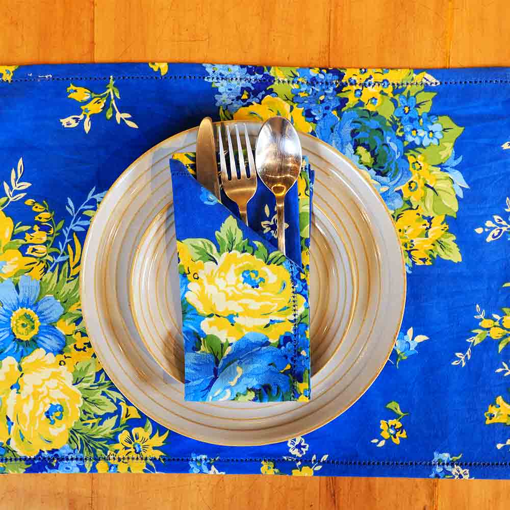 Yellow Marigold Avonlea Blue table napkin — close-up showing handcrafted fabric texture and stitching detail