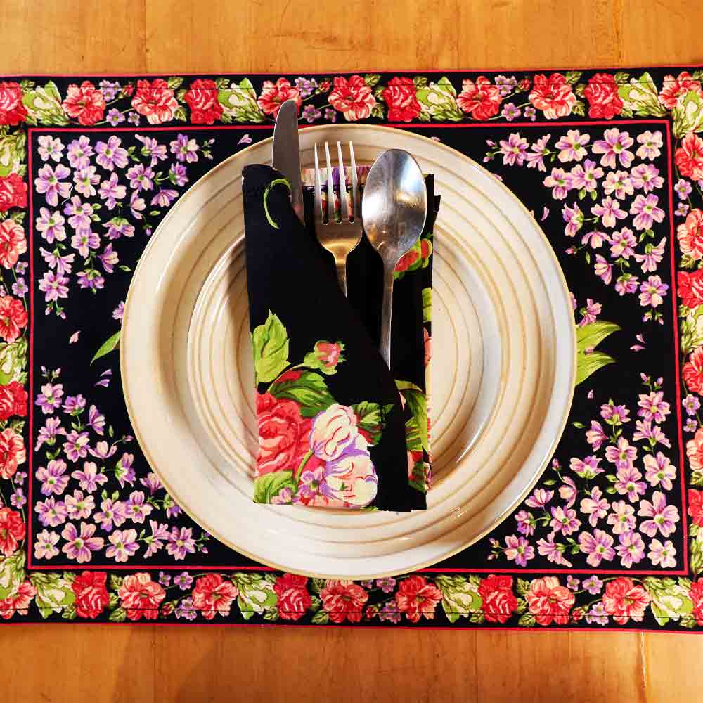 Yellow Marigold Blanche Black Floral napkin — close-up of handcrafted black floral fabric and stitch detail