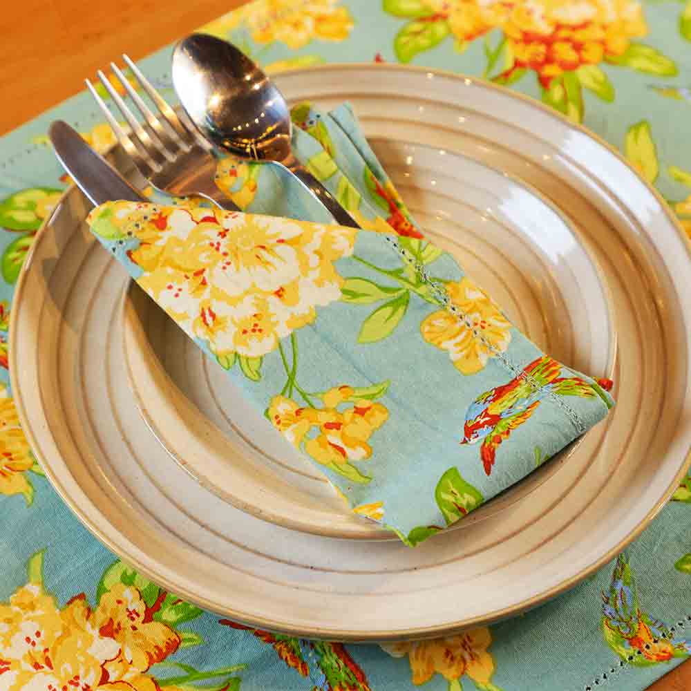 Yellow Marigold Valley of Flowers Mist table napkins set of 6 — floral-print cotton napkins neatly folded