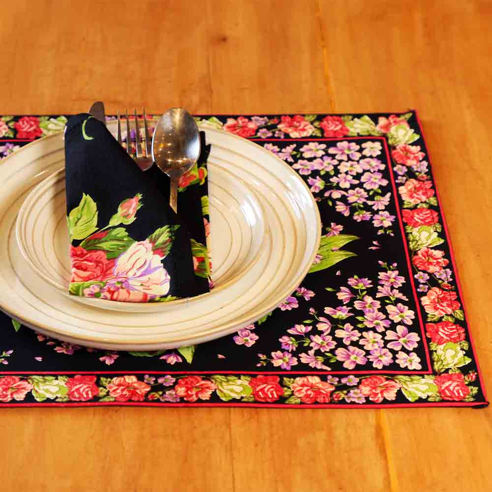 Yellow Marigold Blanche Black Floral Placemats (set of 6) on a wooden dining table with crockery — modern elegant table setting