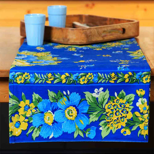 Yellow Marigold Avonlea Blue Floral table runner — blue floral-print table runner laid flat on dining table