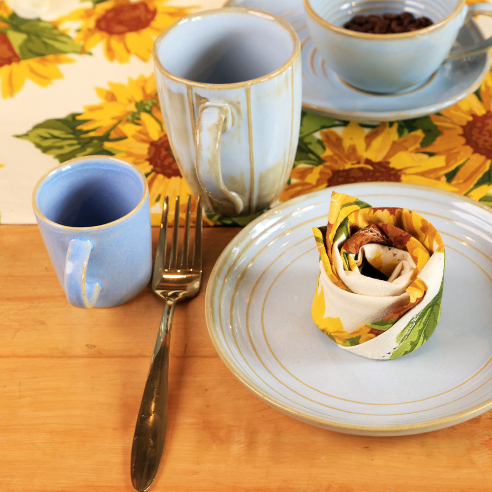 Front view of Yellow Marigold Table Napkins – Sunflower, soft cotton napkins with printed sunflower motifs.