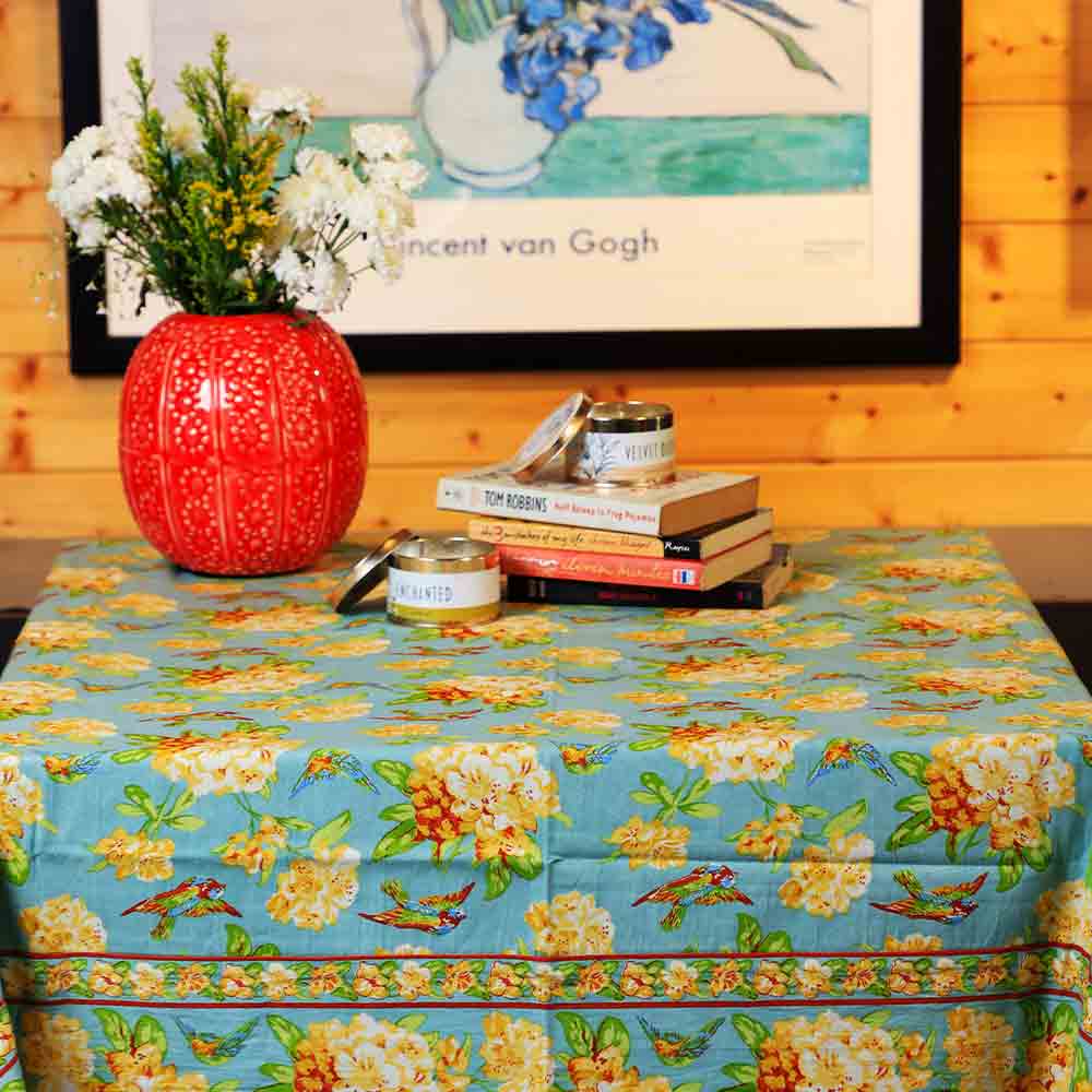 Yellow Marigold Valley of Flowers Mist table cover draped on a wood dining table with crockery and décor — cozy home dining ambience