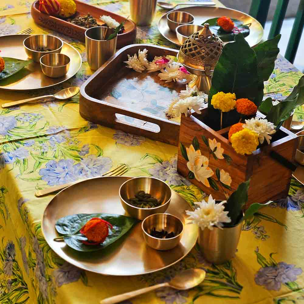 Yellow Marigold Uma Kansa dinner set — close‑up showing handcrafted kansa metal texture and finish of plates and bowls